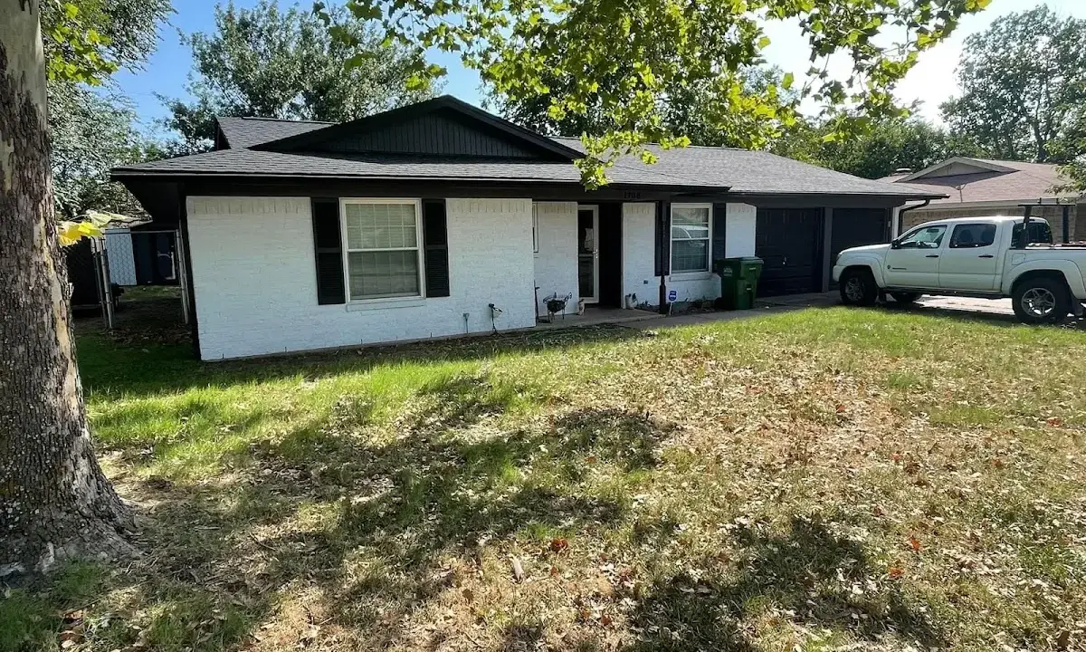 Professional roofing crew working on a residential roof in Sturgis